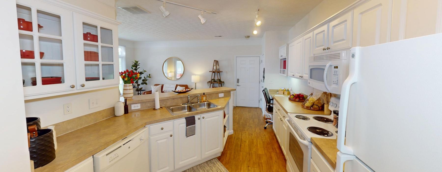a kitchen with white cabinets