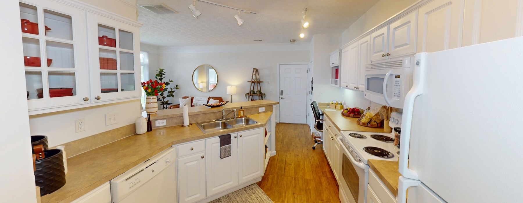 a kitchen with white cabinets
