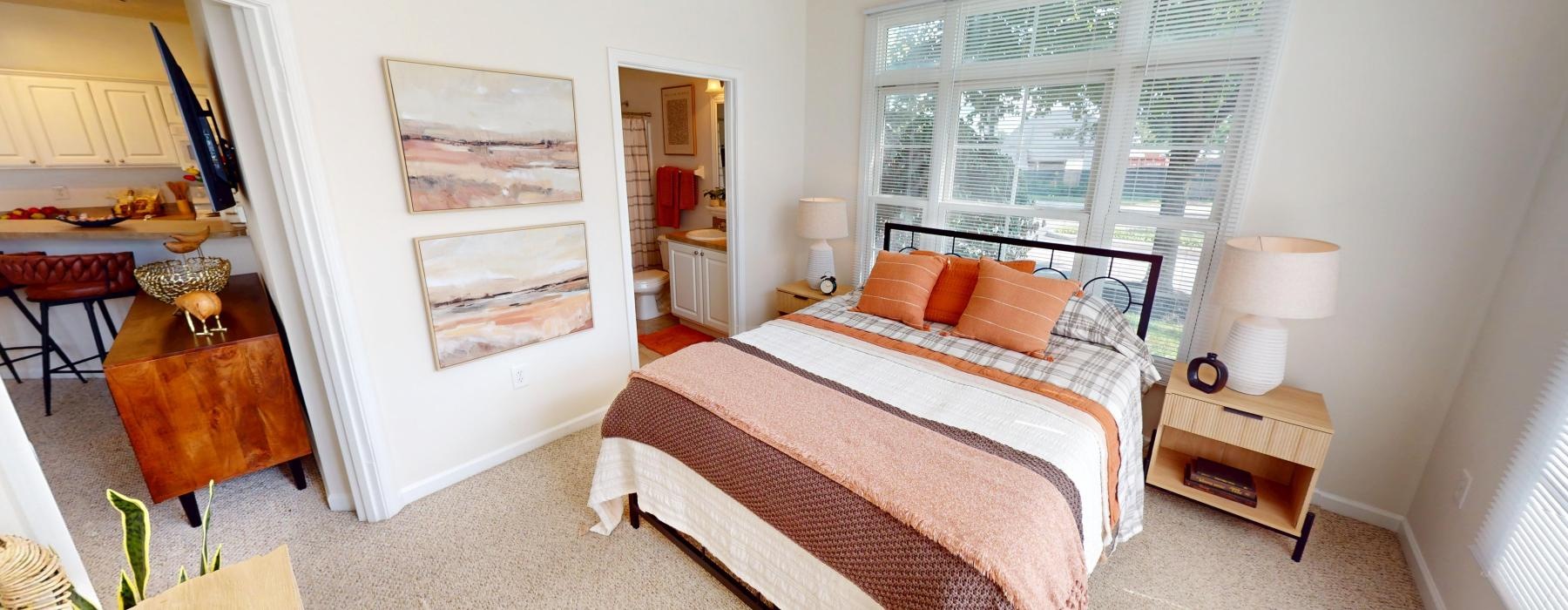 a bedroom with a bed and a desk